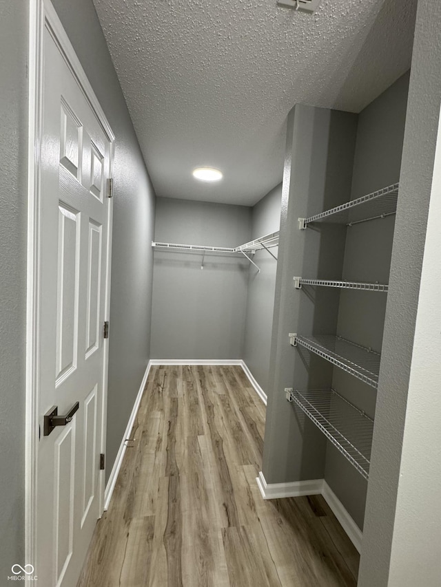 3327 Brandenburg Blvd, Indianapolis, IN 46239 - walk in closet featuring wood finished floors