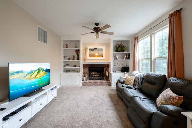13271 Aquamarine Dr, Carmel, IN 46033 - living area with ceiling fan, built in features, a fireplace, and light carpet