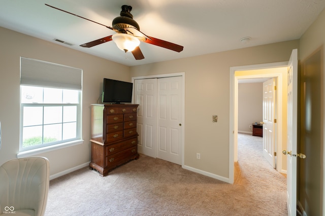 13271 Aquamarine Dr, Carmel, IN 46033 - bedroom with light colored carpet, a closet, and ceiling fan