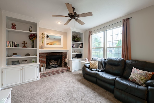 13271 Aquamarine Dr, Carmel, IN 46033 - living room featuring a ceiling fan, a fireplace, light carpet, built in shelves, and ornamental molding