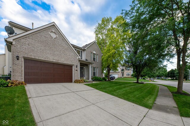 13271 Aquamarine Dr, Carmel, IN 46033 - traditional-style home with brick siding, a front yard, driveway, and a garage