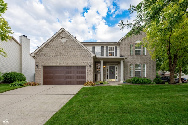 13271 Aquamarine Dr, Carmel, IN 46033 - view of front of property featuring brick siding, a front lawn, a garage, and driveway