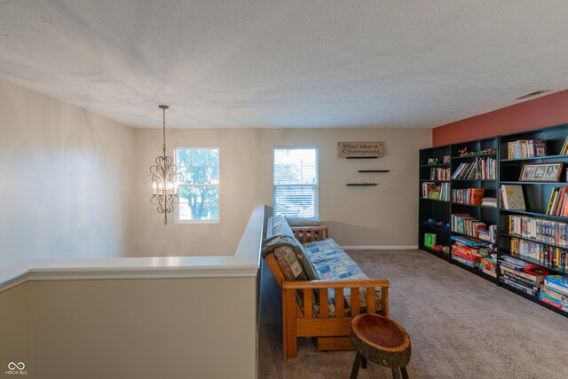 13271 Aquamarine Dr, Carmel, IN 46033 - living area with carpet floors, a chandelier, and a textured ceiling