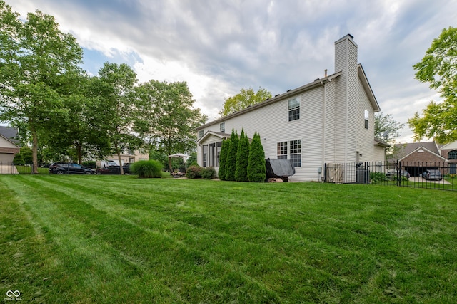 13271 Aquamarine Dr, Carmel, IN 46033 - back of house with a chimney