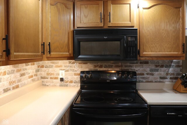 651 N 900 E, Lafayette, IN 47905 - kitchen with black appliances, light countertops, and tasteful backsplash