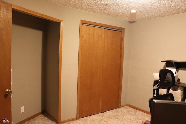 651 N 900 E, Lafayette, IN 47905 - bedroom featuring a closet, light colored carpet, a textured ceiling, and baseboards
