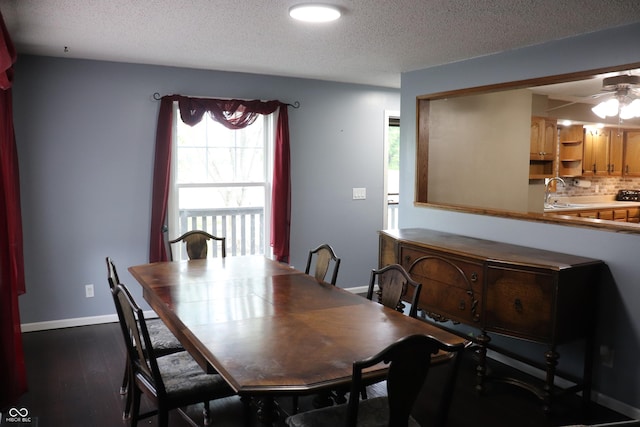 651 N 900 E, Lafayette, IN 47905 - dining space featuring a textured ceiling, a ceiling fan, dark wood-type flooring, and baseboards