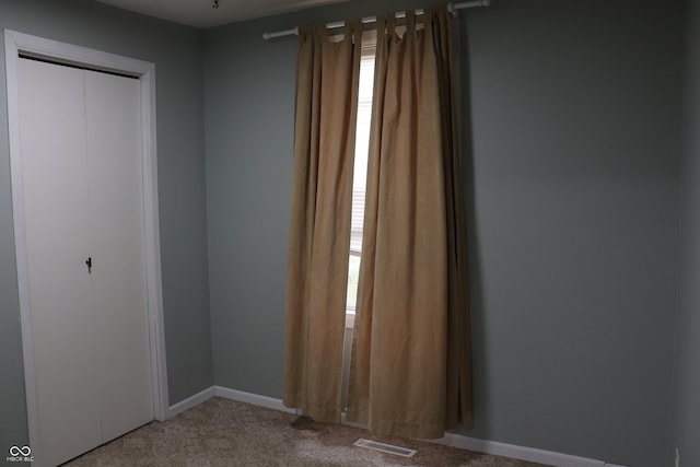 651 N 900 E, Lafayette, IN 47905 - unfurnished bedroom with light carpet, multiple windows, and a closet