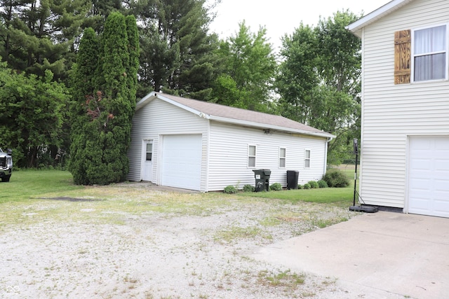 651 N 900 E, Lafayette, IN 47905 - garage featuring view of wooded area