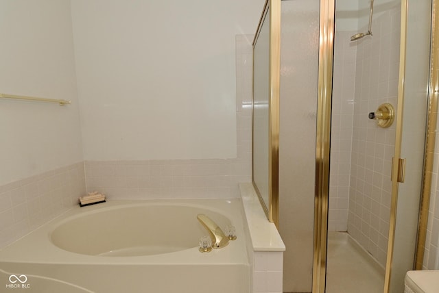 4528 Hunt Master Ct, Indianapolis, IN 46268 - bathroom featuring a shower stall, a bath, and toilet