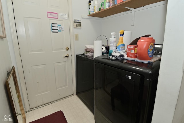 4528 Hunt Master Ct, Indianapolis, IN 46268 - laundry area with washer and clothes dryer and light floors