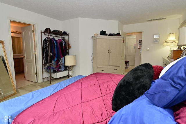 4528 Hunt Master Ct, Indianapolis, IN 46268 - carpeted bedroom featuring a textured ceiling