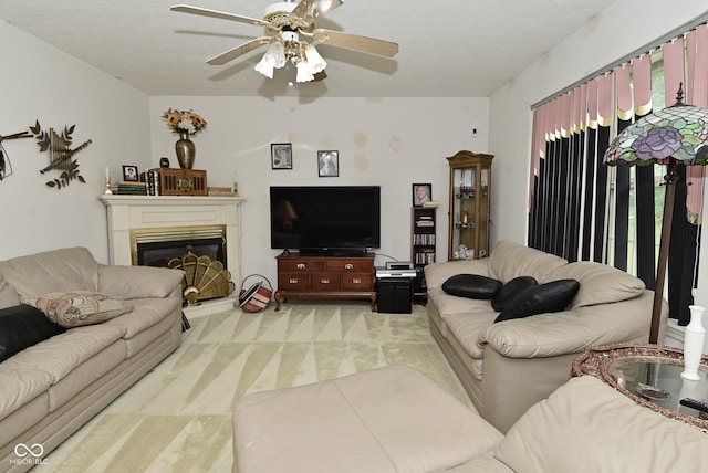 4528 Hunt Master Ct, Indianapolis, IN 46268 - living area featuring light carpet, ceiling fan, and a glass covered fireplace