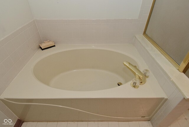 4528 Hunt Master Ct, Indianapolis, IN 46268 - bathroom featuring a garden tub and tile patterned floors