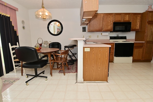 4528 Hunt Master Ct, Indianapolis, IN 46268 - kitchen featuring electric range, black microwave, a sink, brown cabinets, and a peninsula