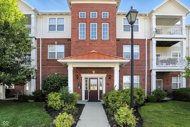17233 Gunther Blvd Unit 102B, Westfield, IN 46074 - multi unit property featuring brick siding, a standing seam roof, and a front lawn
