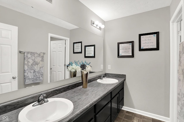 6645 Honeysuckle Way, Pendleton, IN 46064 - bathroom with double vanity and baseboards