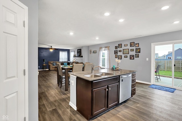 6645 Honeysuckle Way, Pendleton, IN 46064 - kitchen with stainless steel dishwasher, a sink, dark brown cabinets, dark wood-style flooring, and recessed lighting