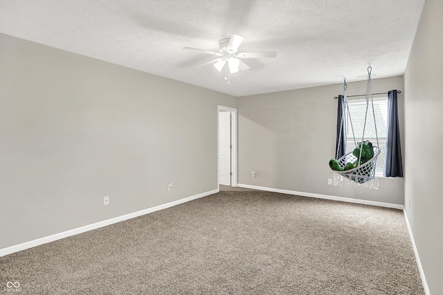 6645 Honeysuckle Way, Pendleton, IN 46064 - empty room with carpet floors, ceiling fan, baseboards, and a textured ceiling