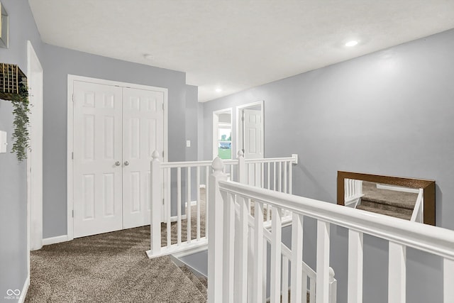 6645 Honeysuckle Way, Pendleton, IN 46064 - hallway with an upstairs landing, carpet floors, and recessed lighting