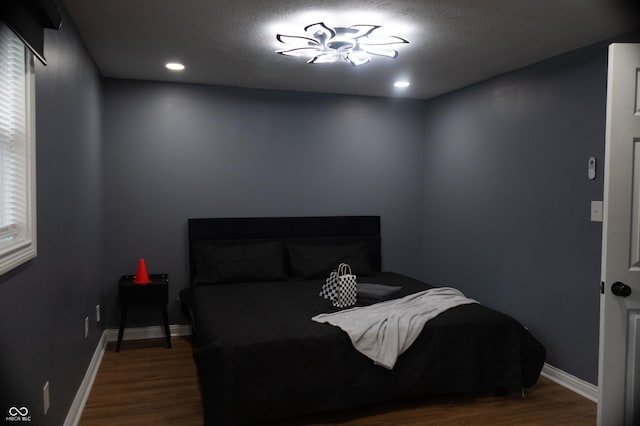 1331 N Berwick Ave, Indianapolis, IN 46222 - bedroom with wood finished floors, baseboards, and recessed lighting