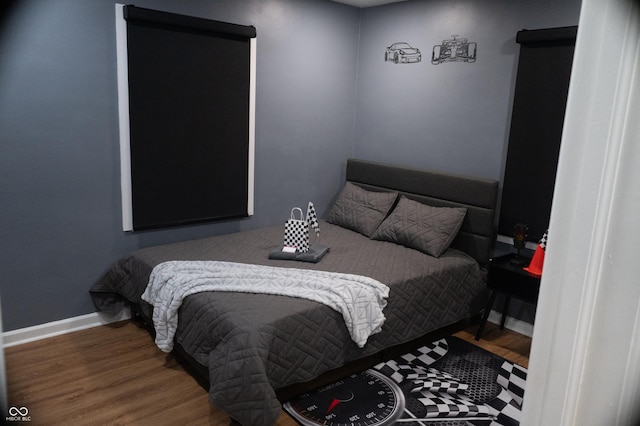 1331 N Berwick Ave, Indianapolis, IN 46222 - bedroom featuring wood finished floors and baseboards