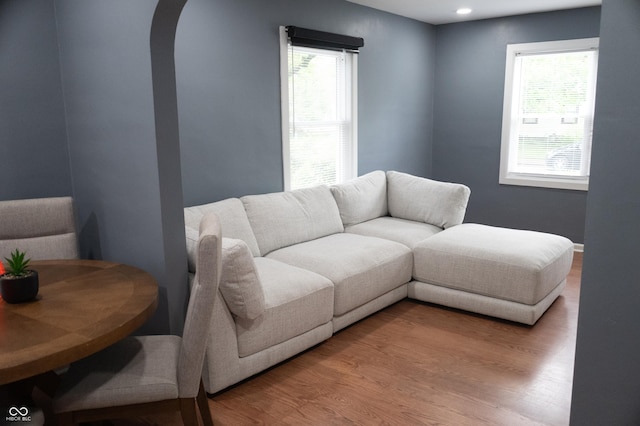 1331 N Berwick Ave, Indianapolis, IN 46222 - living room featuring wood finished floors, arched walkways, and recessed lighting