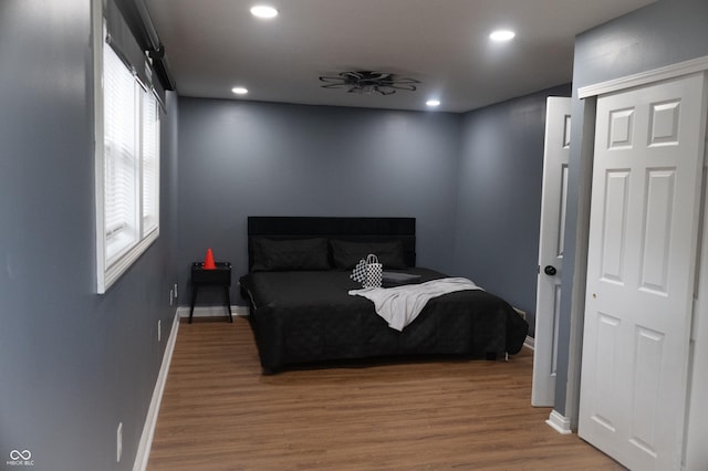 1331 N Berwick Ave, Indianapolis, IN 46222 - bedroom with wood finished floors, baseboards, and recessed lighting