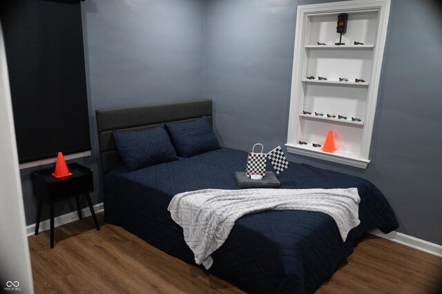 1331 N Berwick Ave, Indianapolis, IN 46222 - bedroom featuring wood finished floors and baseboards
