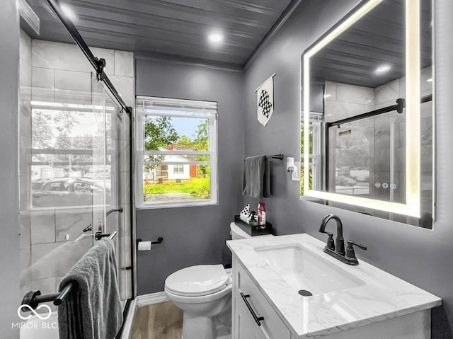 1331 N Berwick Ave, Indianapolis, IN 46222 - bathroom with vanity, a stall shower, and wood finished floors