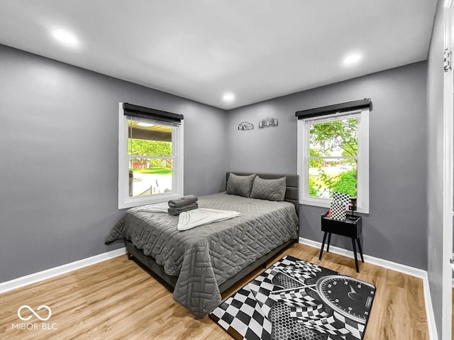 1331 N Berwick Ave, Indianapolis, IN 46222 - bedroom with wood finished floors and recessed lighting