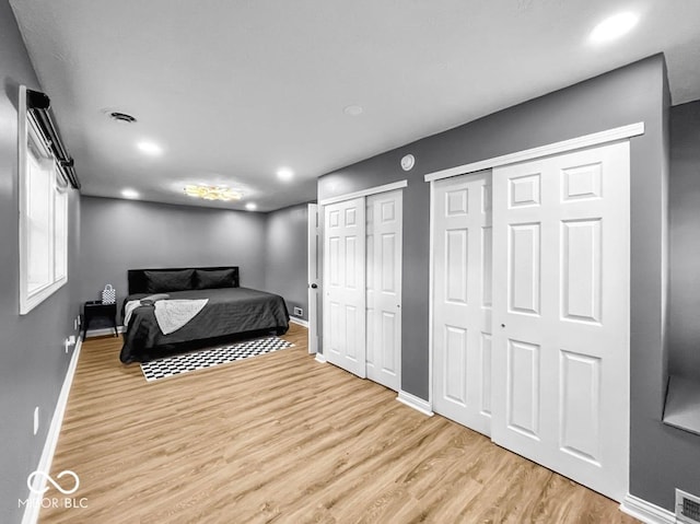 1331 N Berwick Ave, Indianapolis, IN 46222 - bedroom featuring two closets, light wood finished floors, and recessed lighting