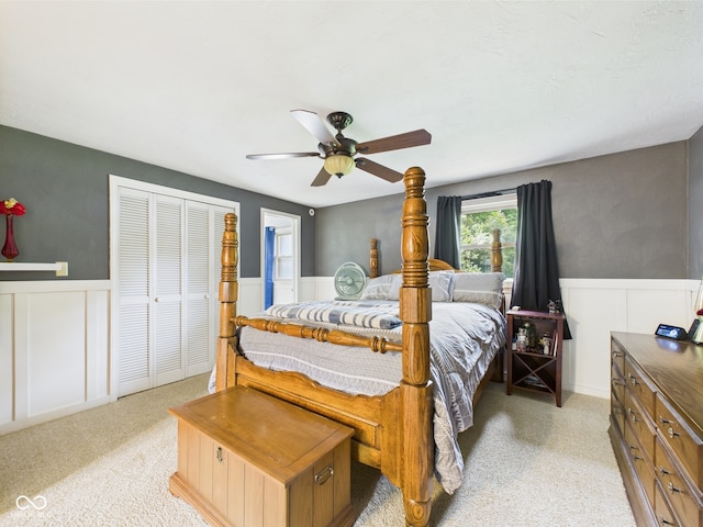 5542 N Olivia Dr, Alexandria, IN 46001 - bedroom with wainscoting, a ceiling fan, a decorative wall, and light carpet