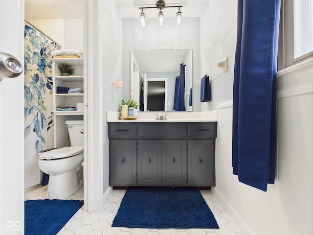 5542 N Olivia Dr, Alexandria, IN 46001 - bathroom with toilet, vanity, and tile patterned flooring
