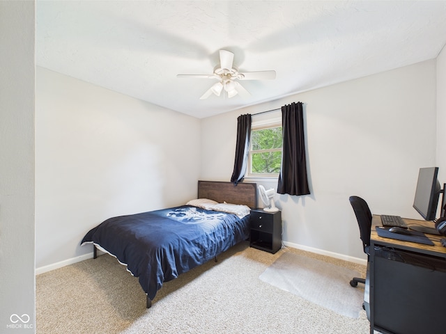 5542 N Olivia Dr, Alexandria, IN 46001 - carpeted bedroom with baseboards, a desk, and ceiling fan