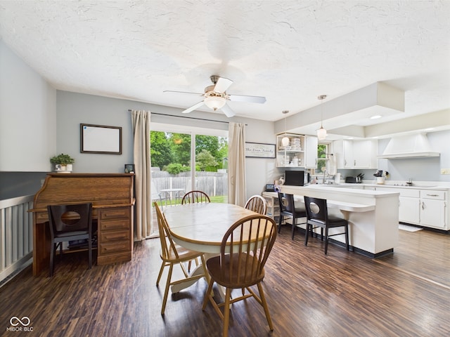 5542 N Olivia Dr, Alexandria, IN 46001 - dining area featuring a textured ceiling, dark wood-style floors, and a ceiling fan