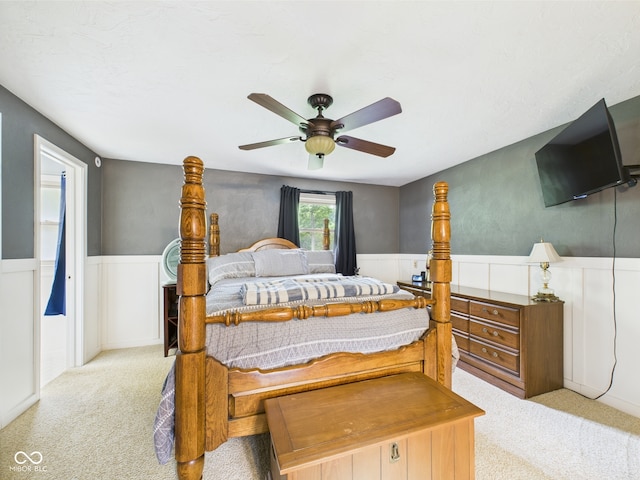 5542 N Olivia Dr, Alexandria, IN 46001 - carpeted bedroom featuring wainscoting and a ceiling fan