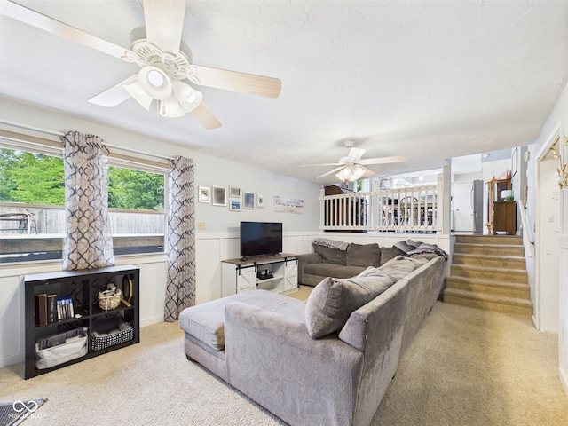 5542 N Olivia Dr, Alexandria, IN 46001 - carpeted living room featuring ceiling fan and a wainscoted wall