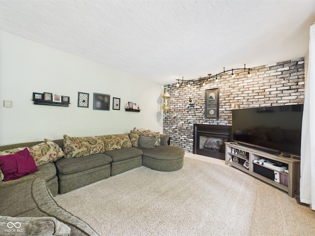 5542 N Olivia Dr, Alexandria, IN 46001 - living area with rail lighting, carpet, a fireplace, brick wall, and a textured ceiling