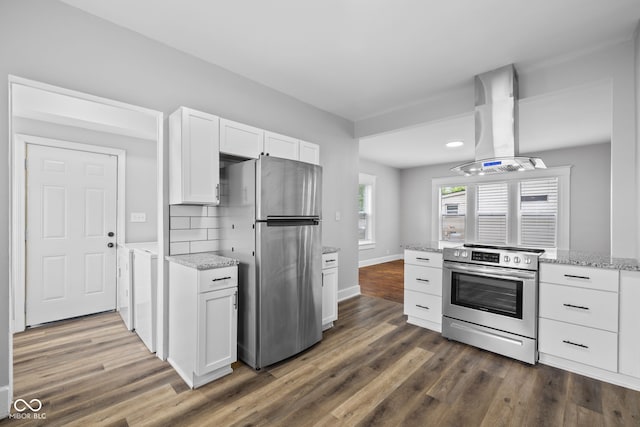 3227 Guilford Ave, Indianapolis, IN 46205 - kitchen with stainless steel appliances, island exhaust hood, white cabinetry, and dark wood finished floors