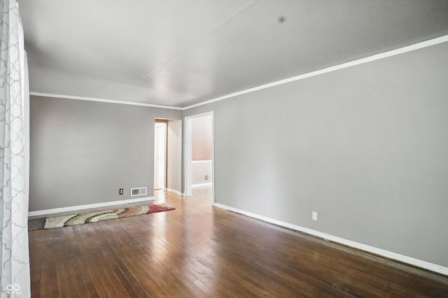 2905 N Warman Ave, Indianapolis, IN 46222 - spare room with baseboards, ornamental molding, and hardwood / wood-style flooring