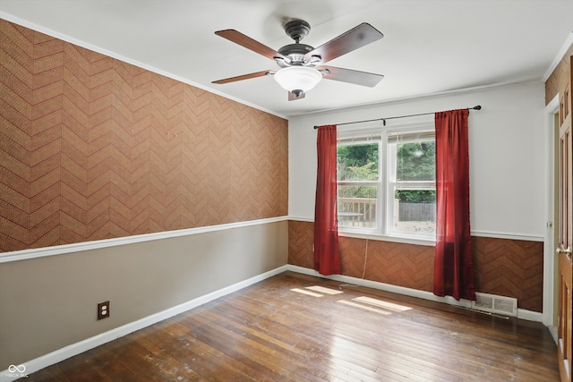 2905 N Warman Ave, Indianapolis, IN 46222 - unfurnished room featuring ornamental molding, ceiling fan, hardwood / wood-style flooring, wainscoting, and baseboards