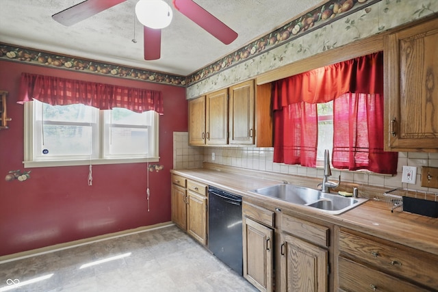 2905 N Warman Ave, Indianapolis, IN 46222 - kitchen with black dishwasher, a sink, tasteful backsplash, brown cabinets, and a textured ceiling