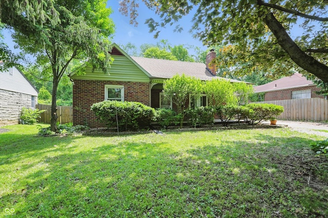 2905 N Warman Ave, Indianapolis, IN 46222 - view of front of home with a chimney and brick siding