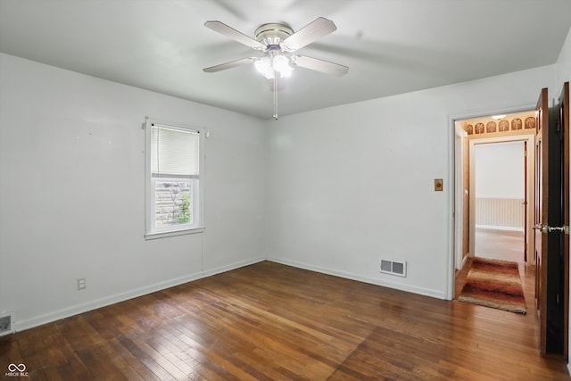 2905 N Warman Ave, Indianapolis, IN 46222 - spare room featuring wood-type flooring, a ceiling fan, and baseboards