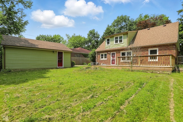 2905 N Warman Ave, Indianapolis, IN 46222 - back of property featuring brick siding, a deck, and an outbuilding
