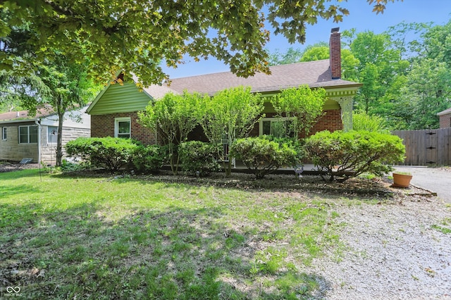 2905 N Warman Ave, Indianapolis, IN 46222 - obstructed view of property with brick siding and a chimney