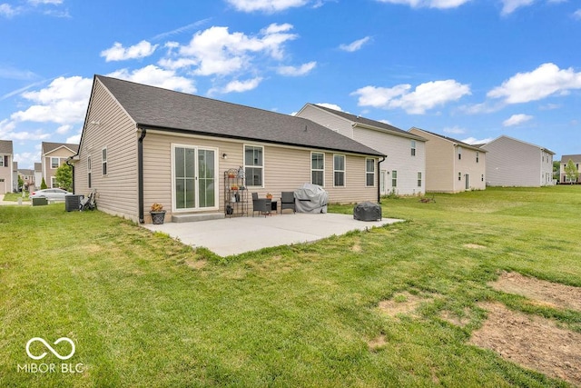 123 Campus Ln, Greenwood, IN 46143 - back of house with a patio, a yard, central AC unit, and a residential view