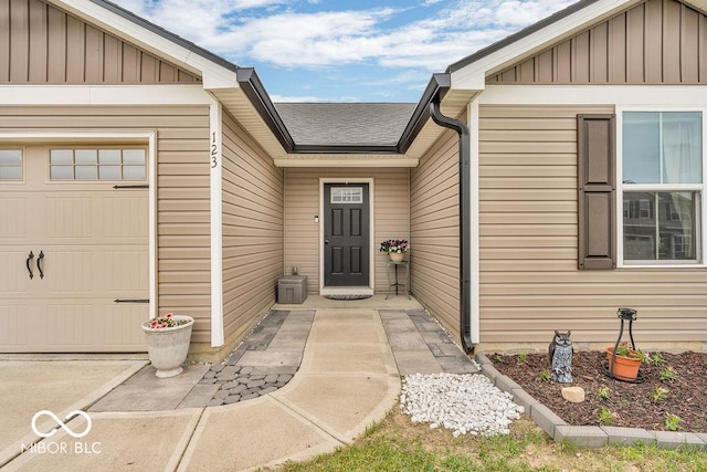 123 Campus Ln, Greenwood, IN 46143 - doorway to property with board and batten siding and a garage