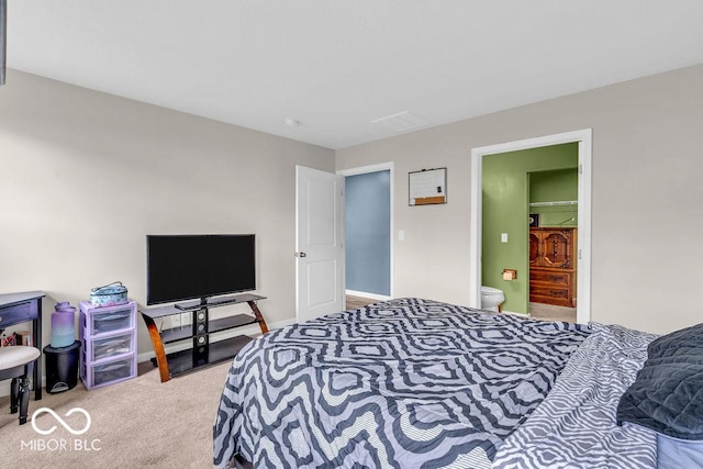 123 Campus Ln, Greenwood, IN 46143 - carpeted bedroom featuring ensuite bath and baseboards